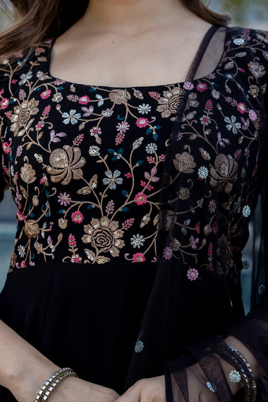 Black embroidered Anarkali gown with floral patterns and a designer dupatta by Pusti Feni