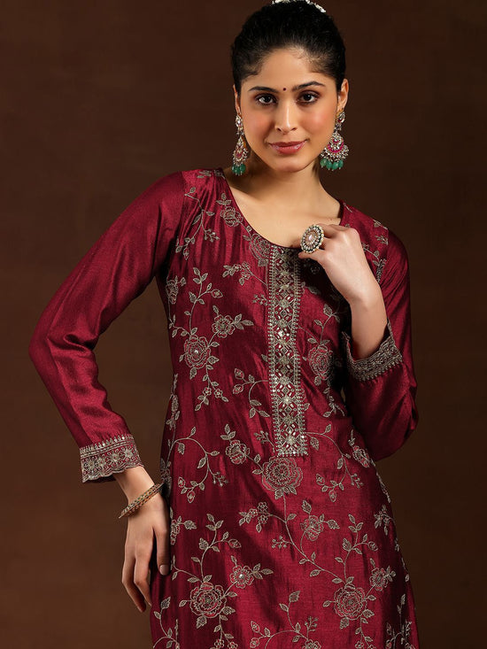 Woman wearing a maroon embroidered Vichitra kurta set by Pushti Feni