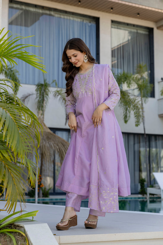 Woman wearing a lavender embroidered Anarkali suit with a designer dupatta by Pusti Feni